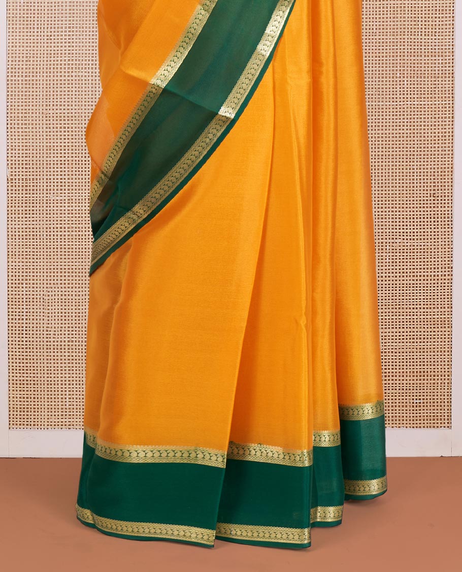 Orange Plain Mysore Silk Saree, Complemented by a Contrast Rettai Pettu Border of Paisley Designs, Pallu Mirrors the Same Border Motifs, and a Contrast Blouse