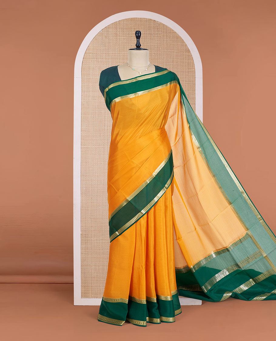 Orange Plain Mysore Silk Saree, Complemented by a Contrast Rettai Pettu Border of Paisley Designs, Pallu Mirrors the Same Border Motifs, and a Contrast Blouse