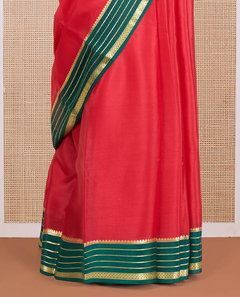 Red Plain Mysore Silk Saree, Complemented by a Contrast Varisai Pettu Border of Traditional Zari Designs, a Subtly Sparkled Pallu of Zari Stripes, and a Contrast Blouse