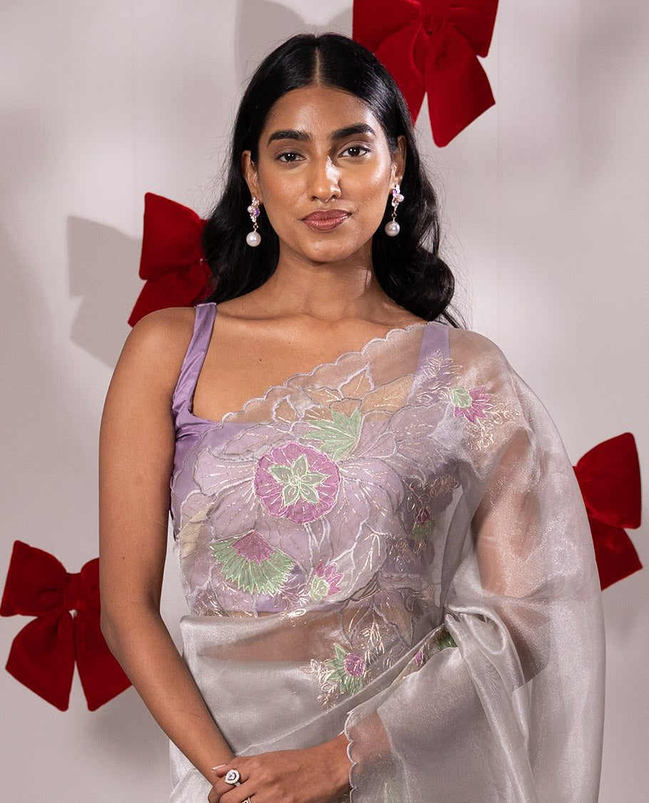 Scintillating grey floral embroidered with golden outlined organza saree, scallop border, and floral embroidered pallu