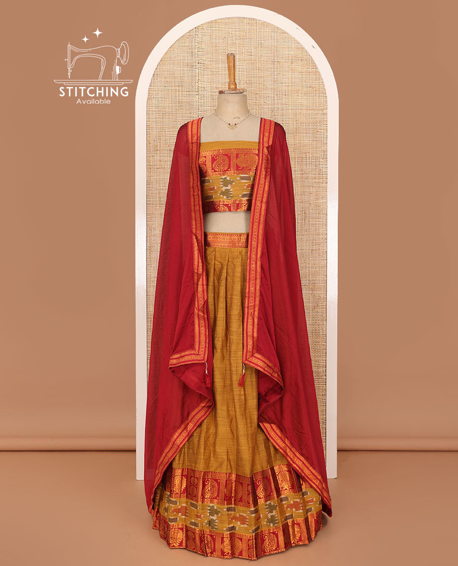 Honey orange lehenga set, plain with contrast manga zari and ikkat border skirt, matching blouse and contrast zari border plain dhavani