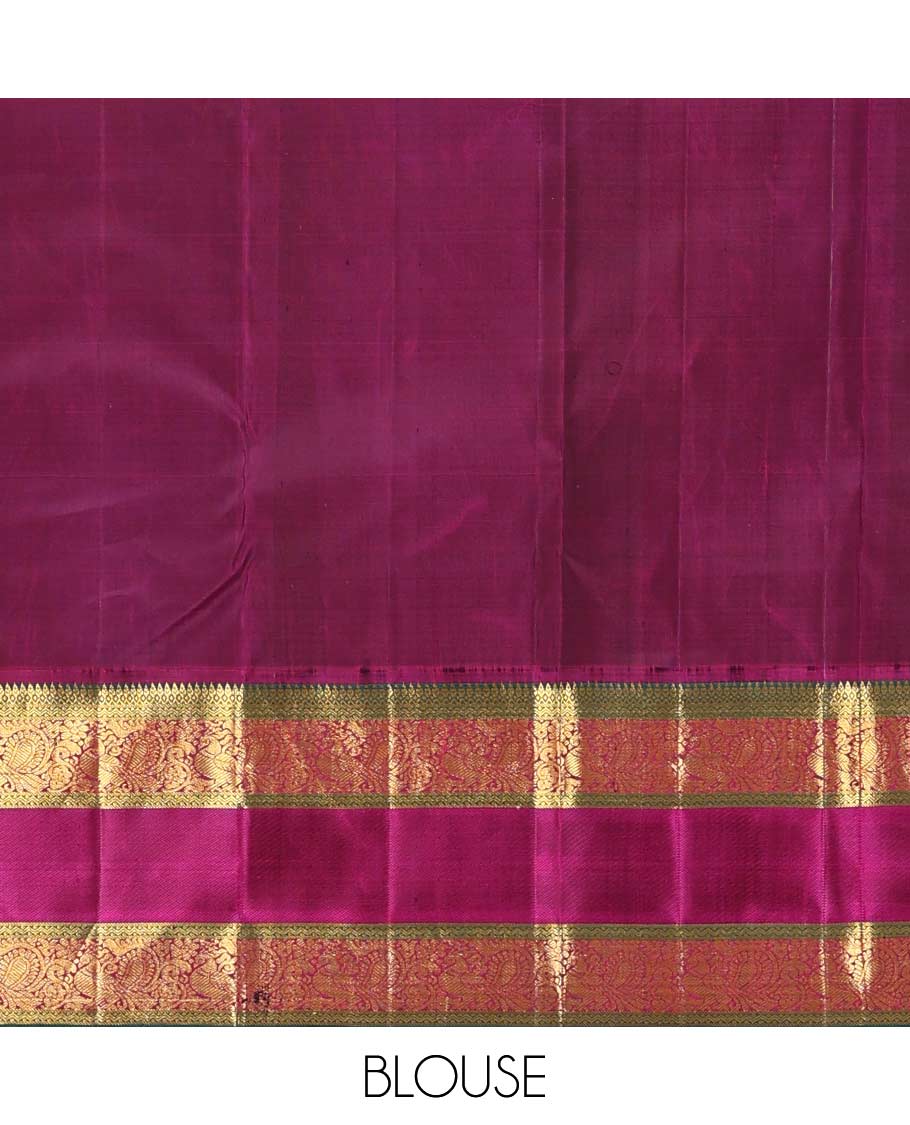 Blue meena buttas Kanchipuram silk saree, contrast korvai border of thilakam mokku, rettai neli, and mayil designs, and geometric patterned pallu