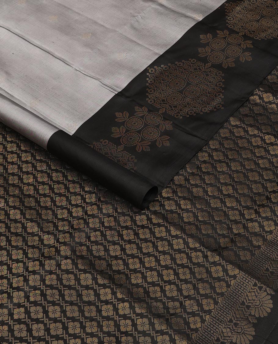 Grey zari buttas soft silk saree, contrast chakram motifs border & floral jaal pallu
