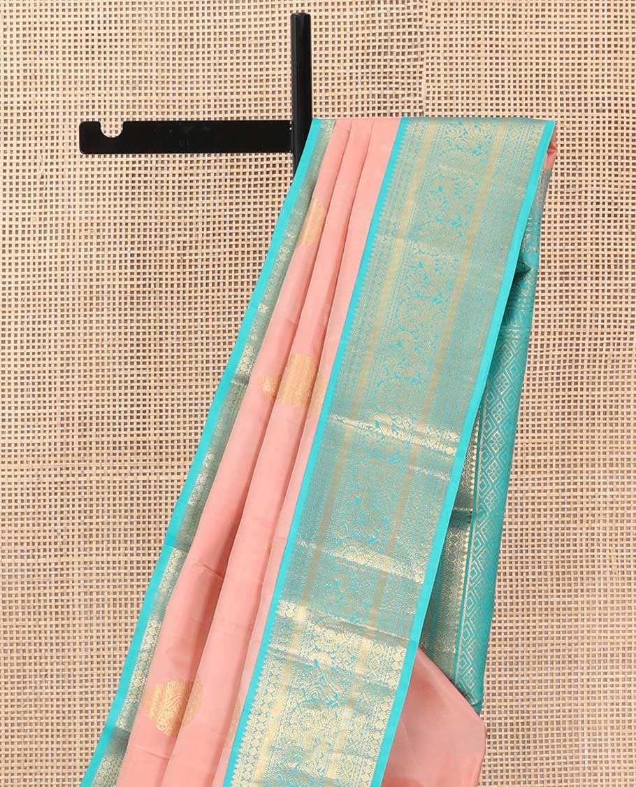 Peach thilakam buttas silk saree, contrast border of thilakam,muthu,poun, and mayil, and pallu of jaal design