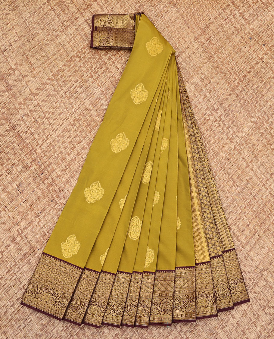 Green Budget Silk Saree, Gleamed Up with Zari Buttas All Over Its Body, Complemented by a Contrast Border of Traditional Motifs in Zari, Pallu Woven with Jaal Design, and Paired with a Contrast Blouse