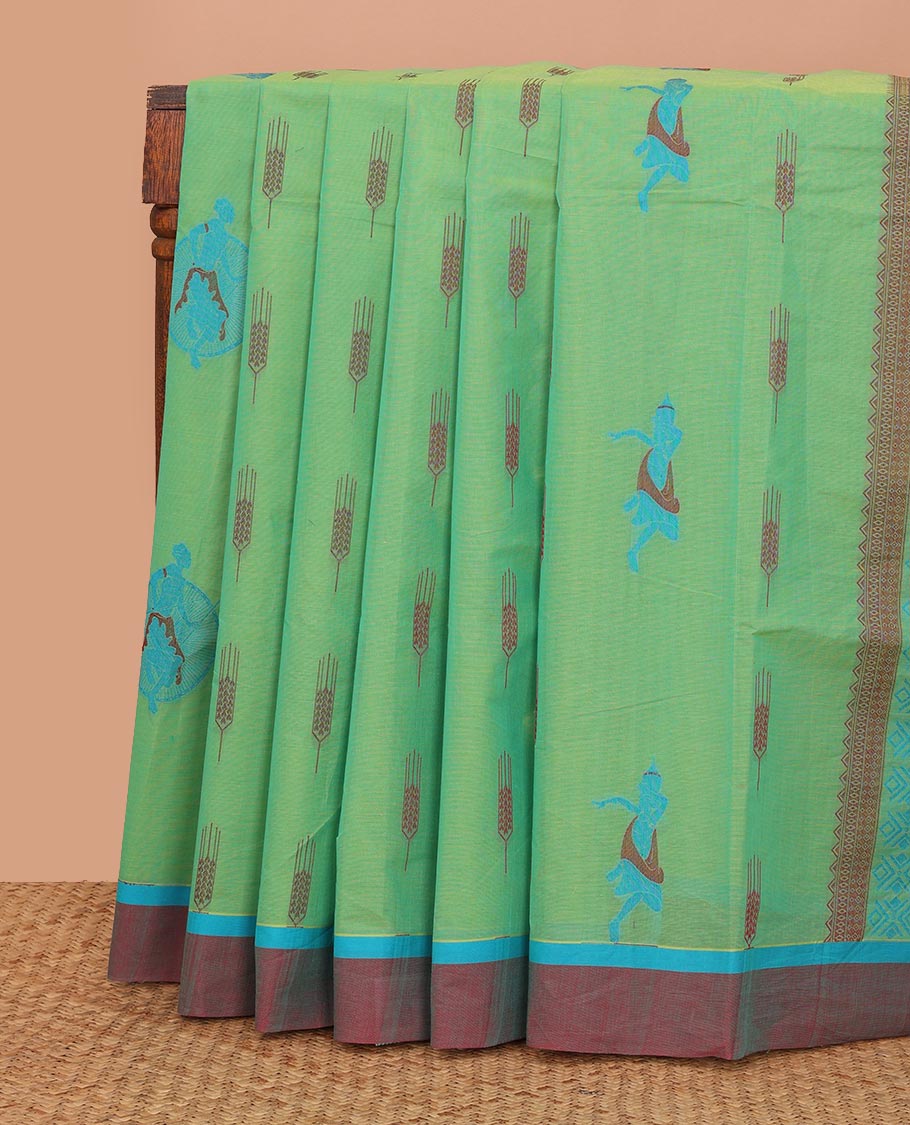 Green buttas Kanchi cotton saree, contrast plain border, and pallu of human figurines