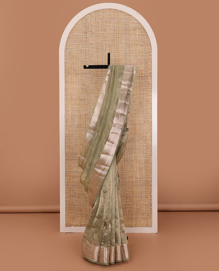 Pastel green sparesely striped tissue saree, Mughal style zari woven border, and intricately zari woven pallu