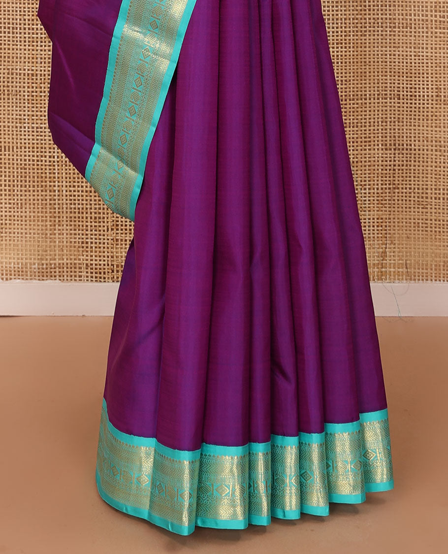Purple plain Kanchipuram silk saree, contrast korvai border of thilakam mokku, muthu, vanki, lavangam, neli, diamond, and manga designs, and jaal pallu