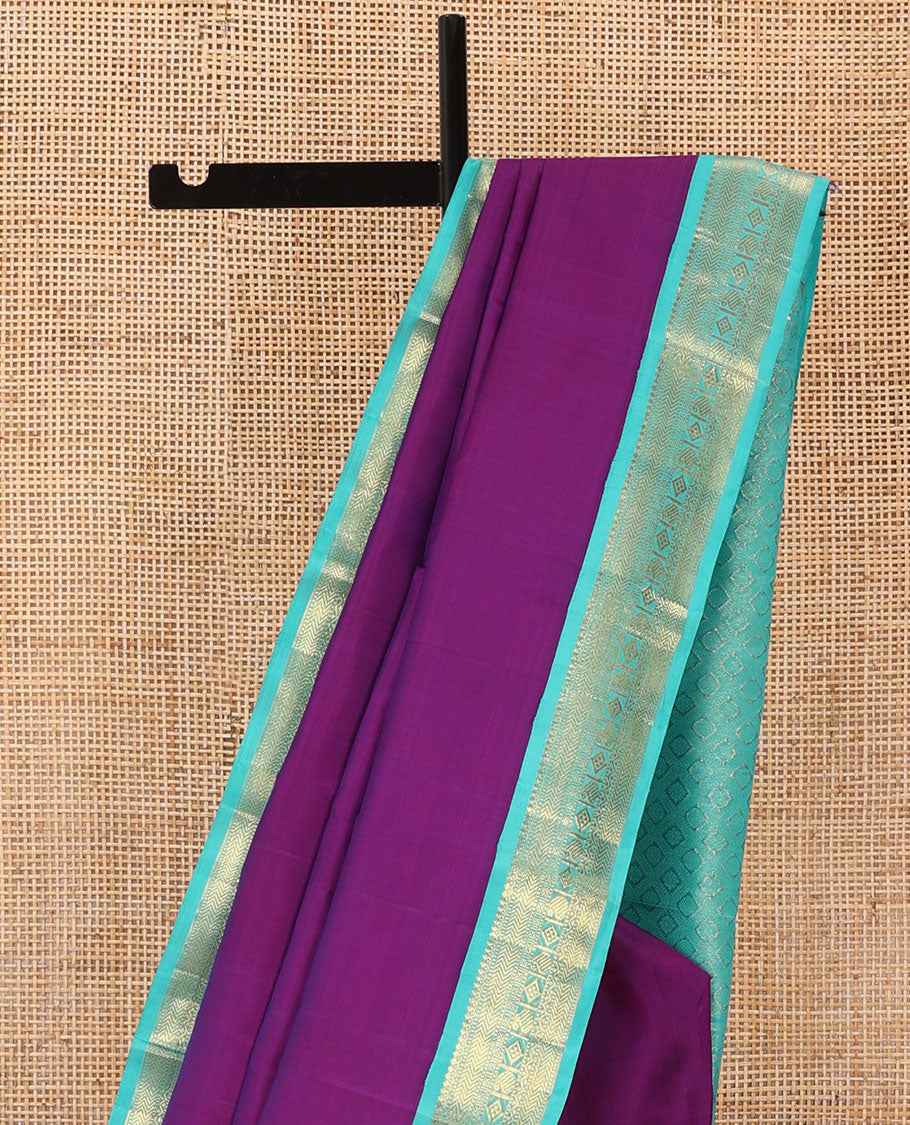 Purple plain Kanchipuram silk saree, contrast korvai border of thilakam mokku, muthu, vanki, lavangam, neli, diamond, and manga designs, and jaal pallu