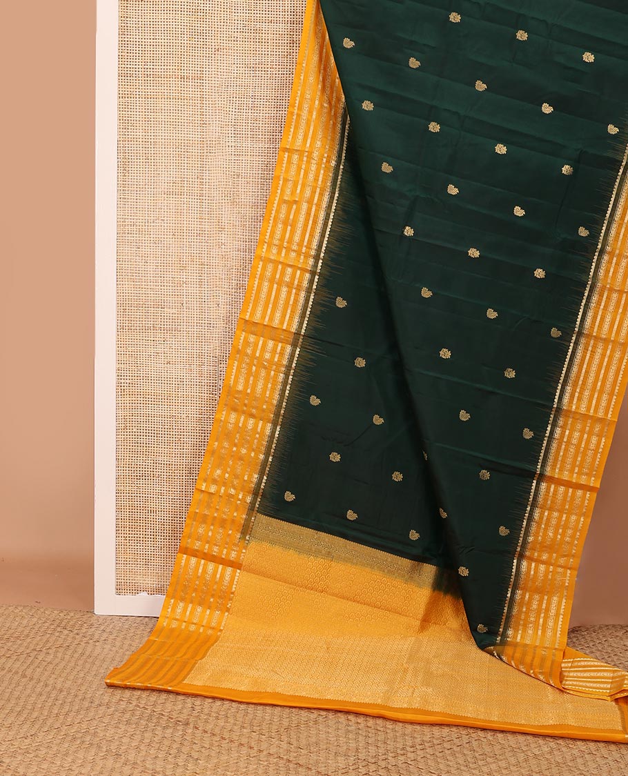 Green zari buttas silk saree, contrast border of muthu,dhavana kodi, laddu kamalam & diamond, & intricate pallu