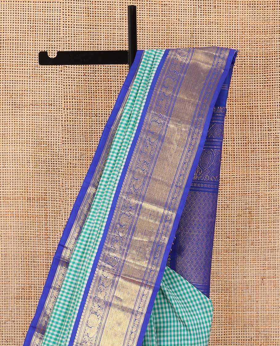 Blue micro-checked Kanchipuram silk saree, contrast korvai border of manga mokku,kathir,muthu,manga and mayil and jaal pallu