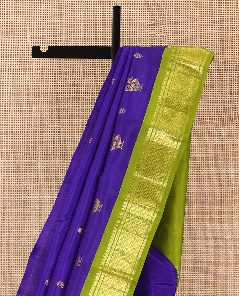 Blue zari buttas Kanchipuram silk saree, contrast one-sided border of thilakam mokku, banaras, and jaal designs, and pallu of mayil motifs