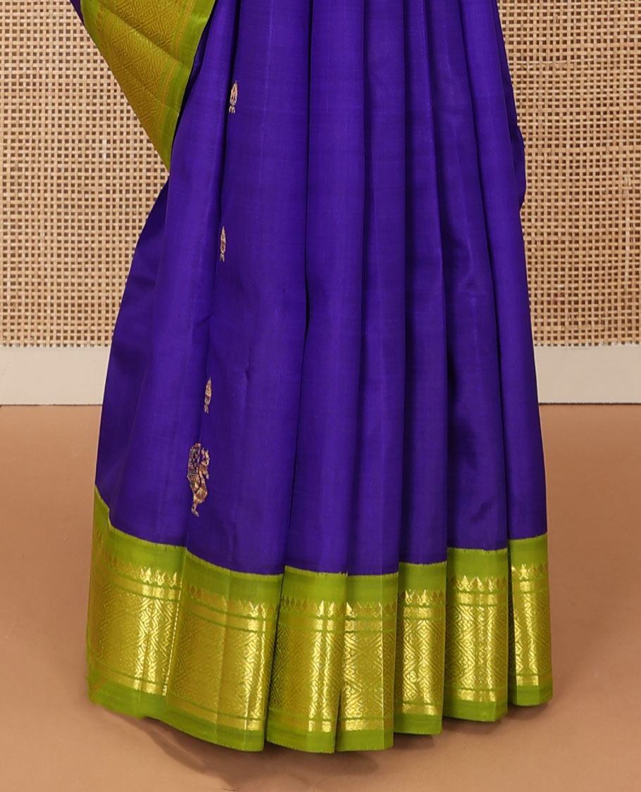 Blue zari buttas Kanchipuram silk saree, contrast one-sided border of thilakam mokku, banaras, and jaal designs, and pallu of mayil motifs