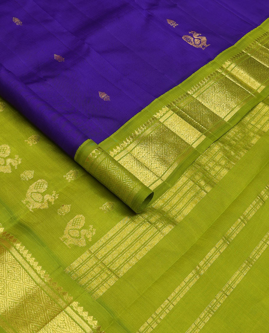 Blue zari buttas Kanchipuram silk saree, contrast one-sided border of thilakam mokku, banaras, and jaal designs, and pallu of mayil motifs