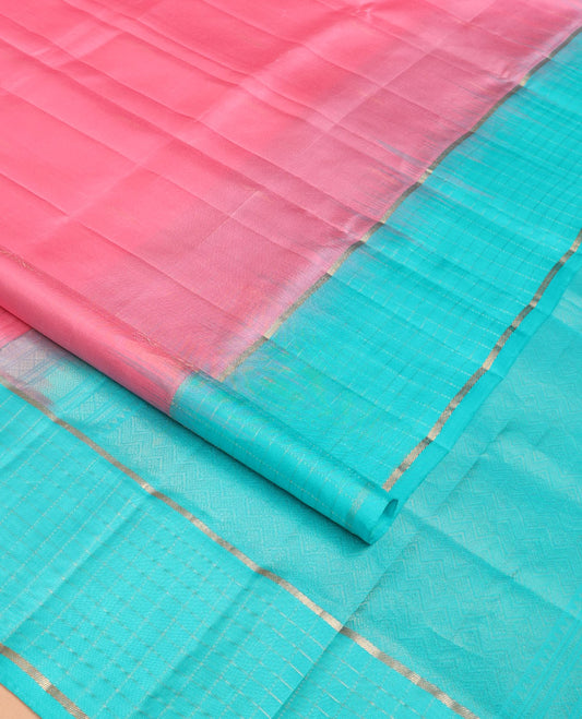 Pink plain design soft silk saree, contrast zari checked blue border & pallu of chevron pattern