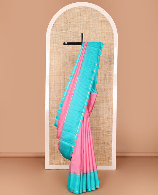 Pink plain design soft silk saree, contrast zari checked blue border & pallu of chevron pattern