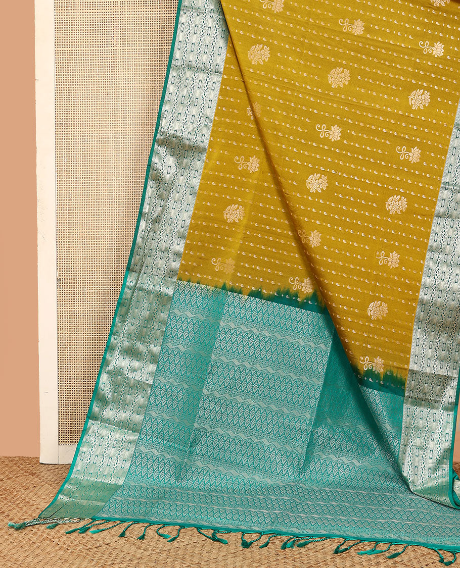 Mustard floral buttas soft silk saree, contrast traditional zari design border, and pallu of geometric patterns