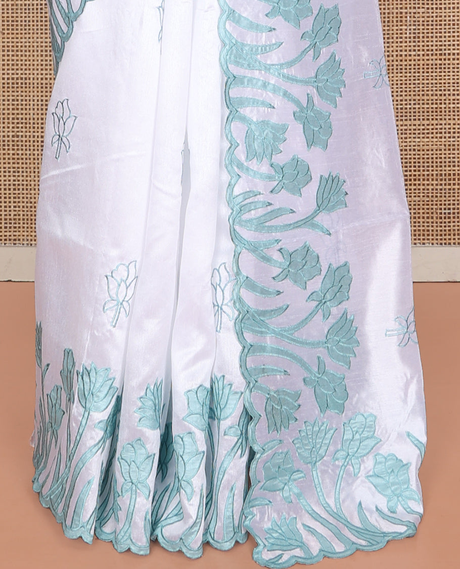 White Fancy Tussar Saree, Elegantly Highlighted with Floral Vine Embroidery, a Scallop Border, and a Matching Blouse
