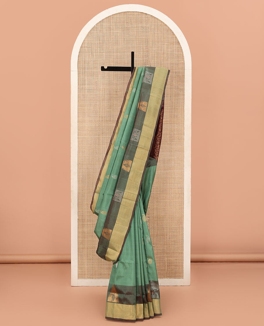 Green Uppada Silk Saree Accentuated with Paisley Buttas, Subtle Contrast Border of Temple Gopuram Motifs, Captivating Pallu Featuring Floral Jaal Design, and Paired with a Contrast Blouse