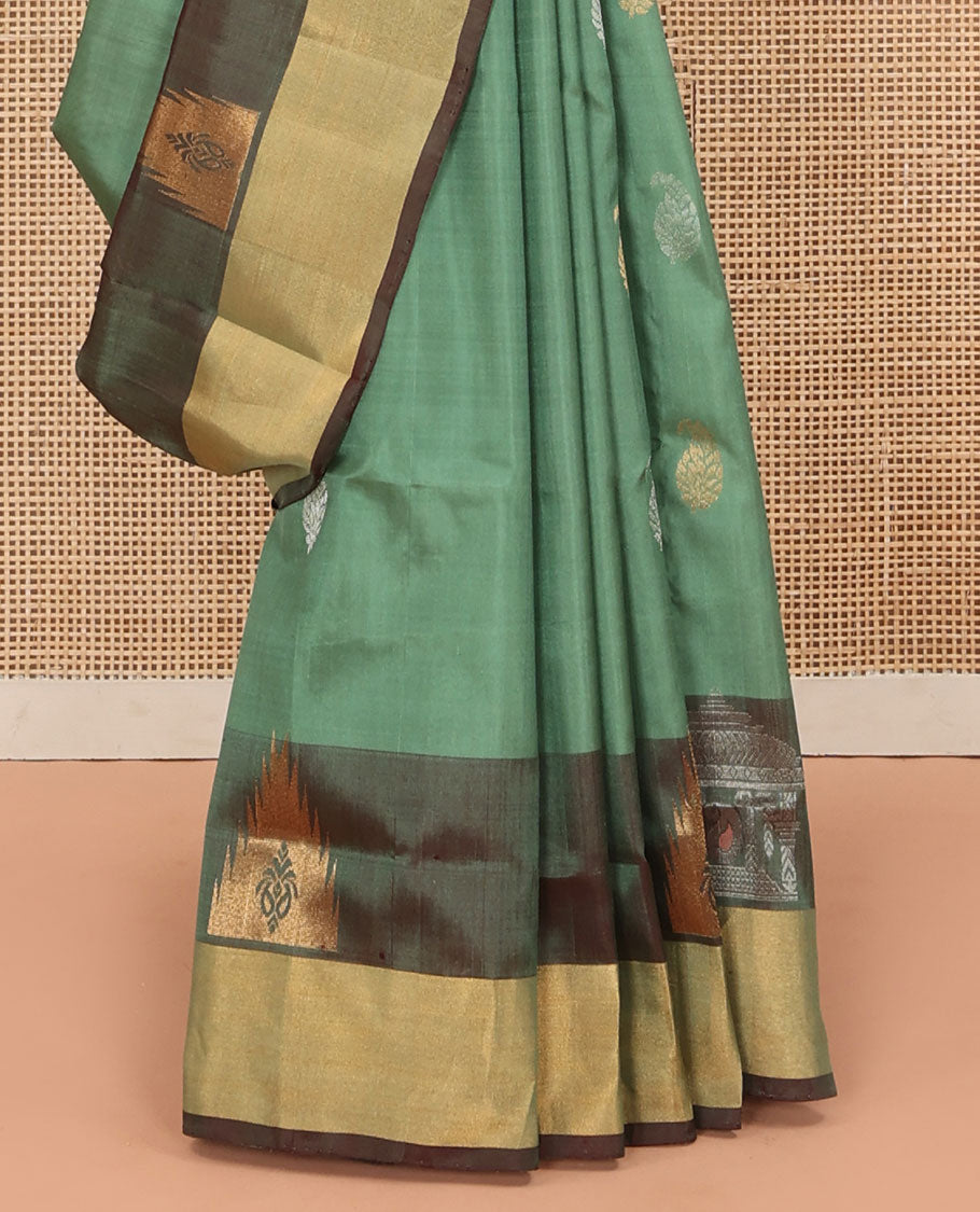 Green Uppada Silk Saree Accentuated with Paisley Buttas, Subtle Contrast Border of Temple Gopuram Motifs, Captivating Pallu Featuring Floral Jaal Design, and Paired with a Contrast Blouse