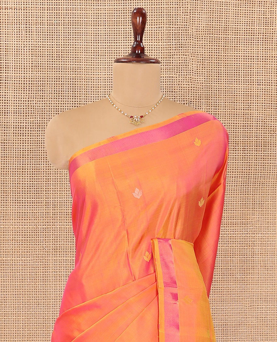 Orange Uppada Silk Saree Decorated with Zari Buttas, Complemented by Bavanji Border, Pallu Depicting Floral Motifs, and Paired with a Matching Blouse
