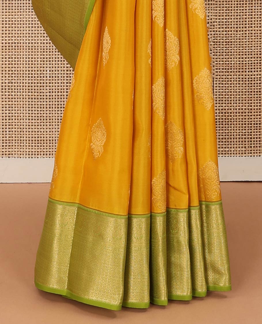 Yellow zari buttas Vasundhara silk mix saree, contrast border of muthu, mayil, kamalam, jaal designs, and pallu of kodi visiry designs