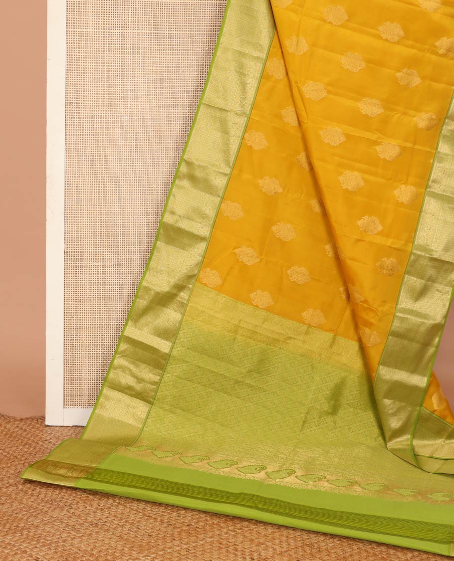 Yellow zari buttas Vasundhara silk mix saree, contrast border of muthu, mayil, kamalam, jaal designs, and pallu of kodi visiry designs