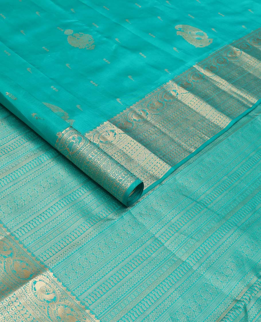 Blue zari buttas silk saree, zari border and pallu steeped with rekku, mayil, rudraksham, manga, kathir, cross neli and laddu kamalam