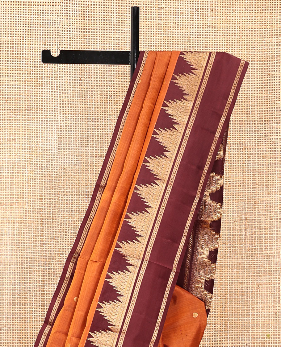 Orange Vasundhara Silk Saree, Delicately Woven with Zari Buttas, Complemented by a Contrast Rettai Pettu Border of Thazampoo Rekku Designs, Vanki Pallu, and a Contrast Blouse