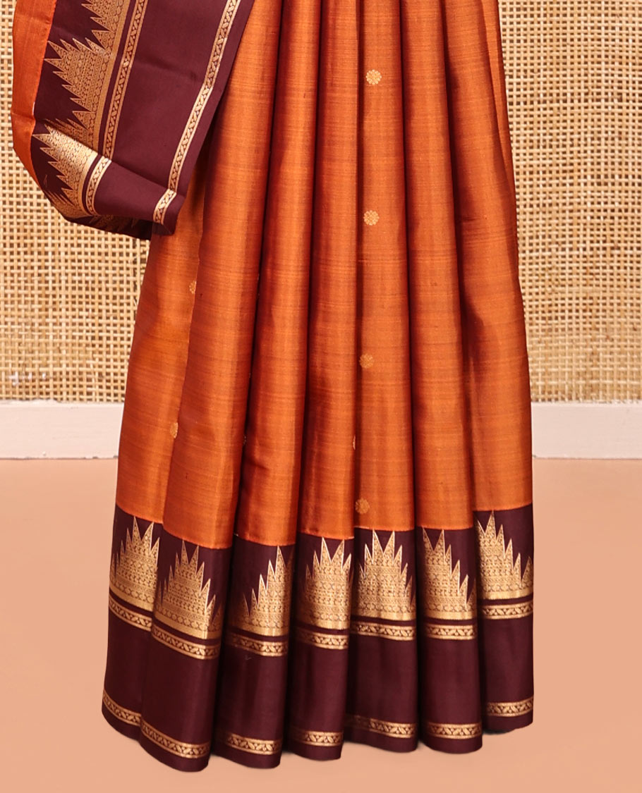 Orange Vasundhara Silk Saree, Delicately Woven with Zari Buttas, Complemented by a Contrast Rettai Pettu Border of Thazampoo Rekku Designs, Vanki Pallu, and a Contrast Blouse