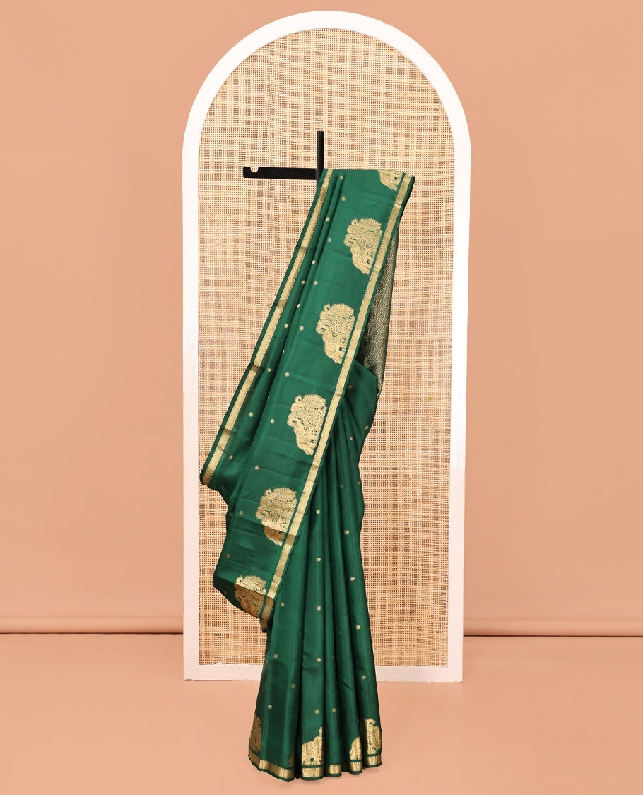 Green Vasundhara Silk Saree, Majestically Detailed with Zari Buttas and Mayil-Yaanai Buttas, a Subtle Zari Border, Jaal Pallu, and a Matching Blouse