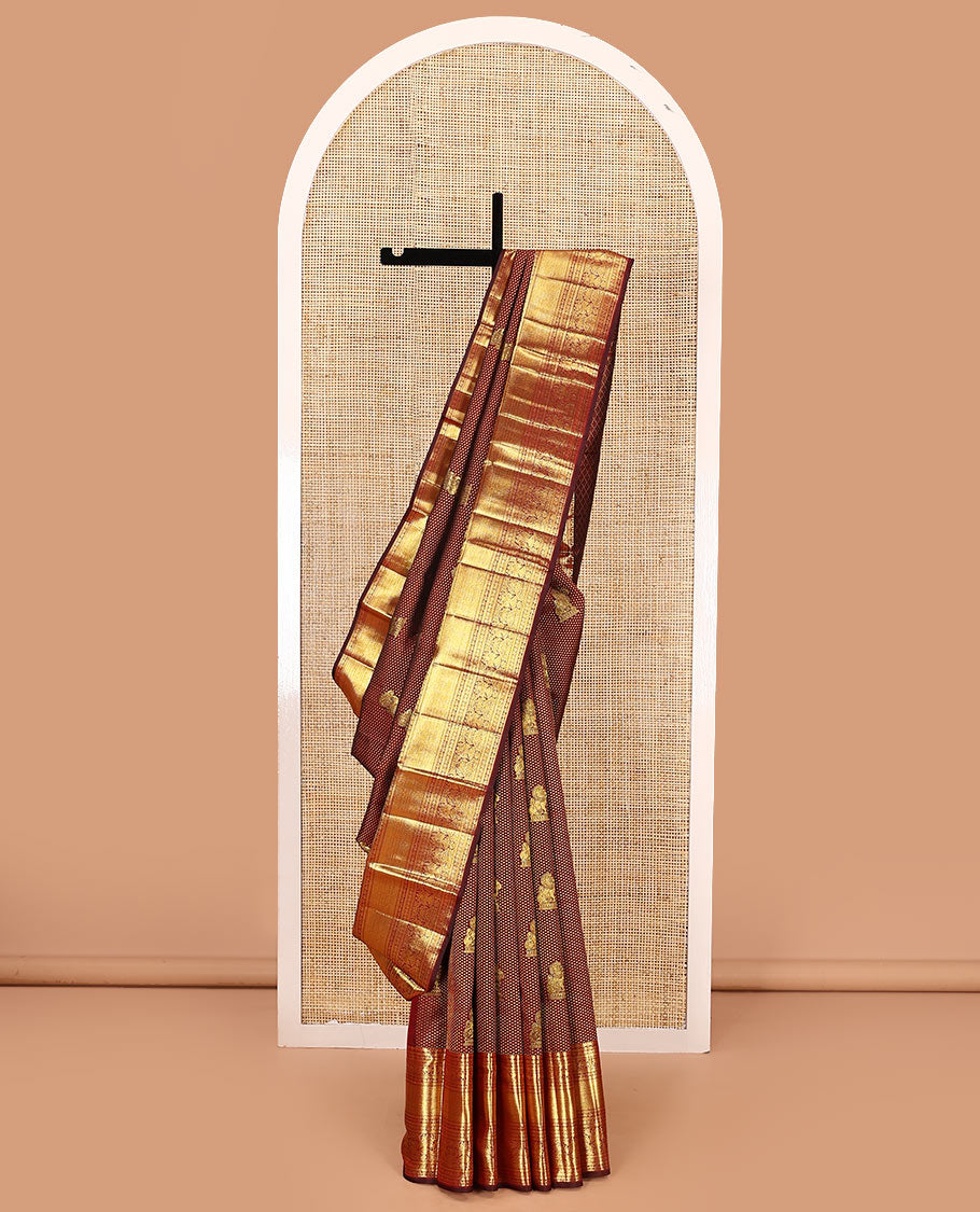 Maroon singam buttas woven kanchipuram silk saree, zari border of muthu, banaras, manga kodi, yaali, kuthirai, yaanai, mayil kann, rudraksham, and iruthalai pakshi, and jaal pallu