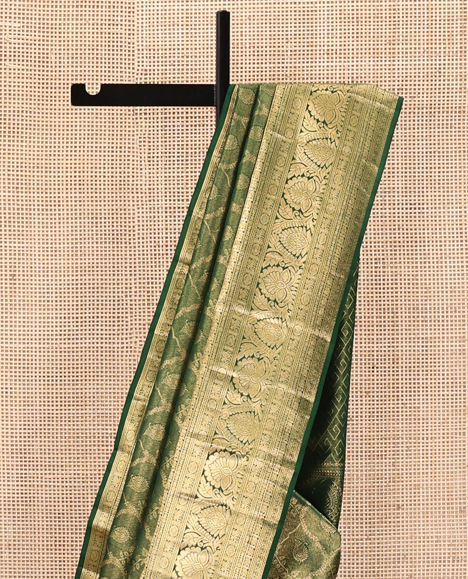 Green Kanchipuram Wedding Silk Saree, Elevated with Jacquard Designs on Its Body, Highlighted by a Traditional Zari Border of Kuthirai, Chakram, and Mayil Designs, Pallu of Greek Key Designs, and Paired with a Matching Blouse