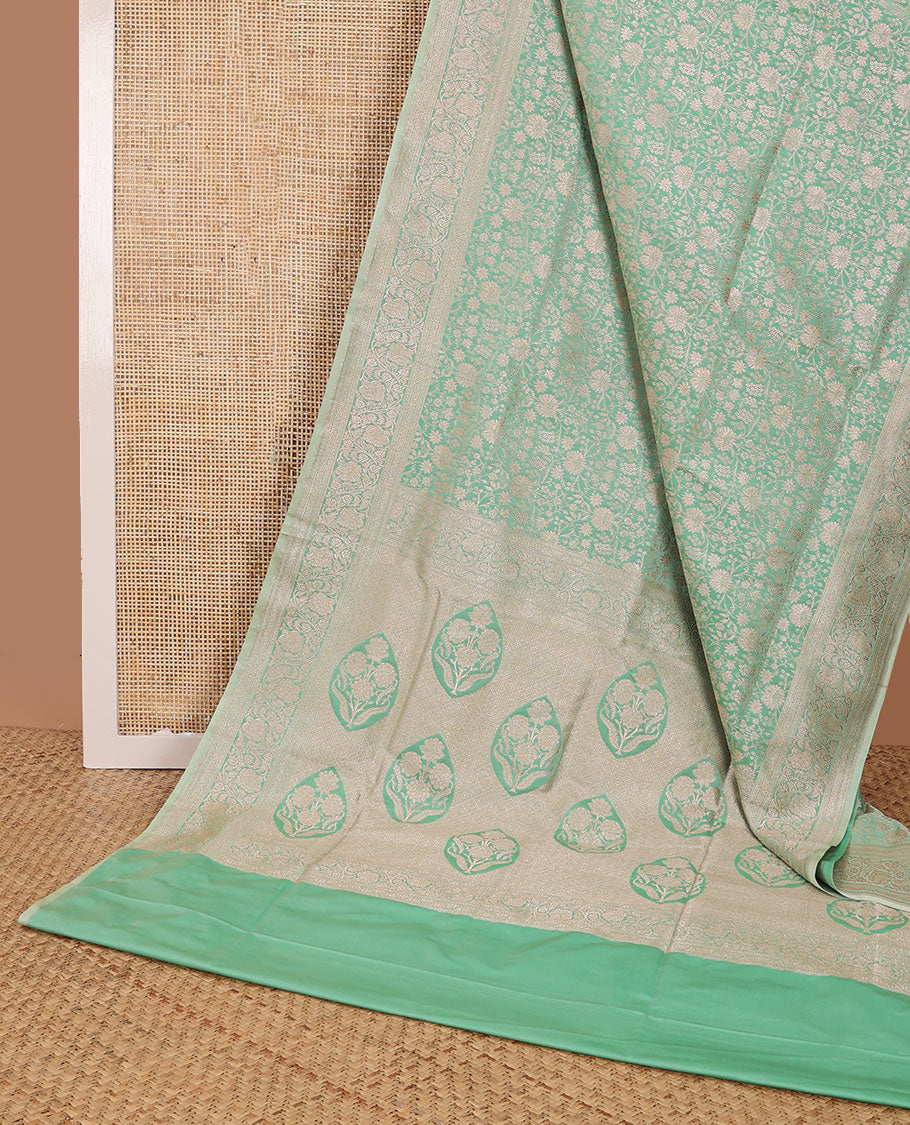 Green floral jacquard banaras silk saree with self border of zari design & floral design pallu