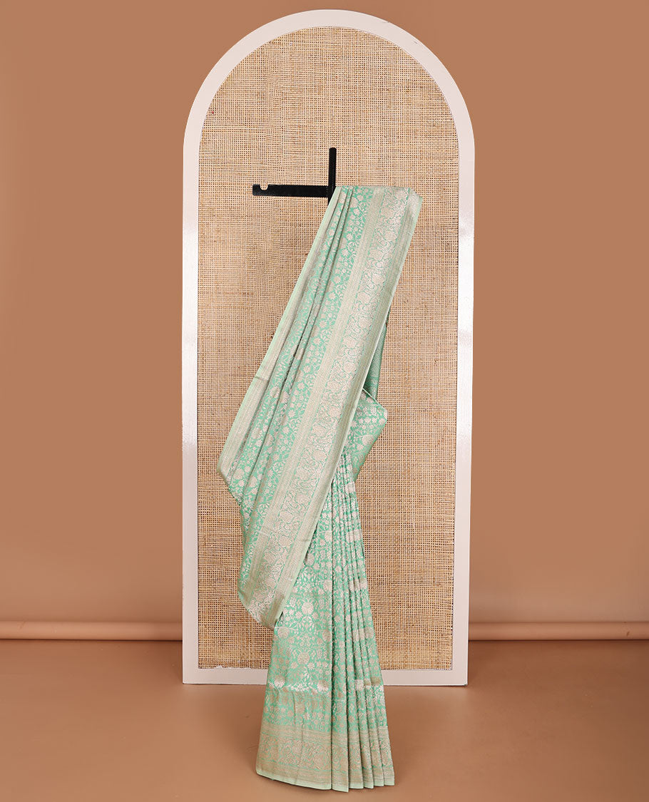 Green floral jacquard banaras silk saree with self border of zari design & floral design pallu
