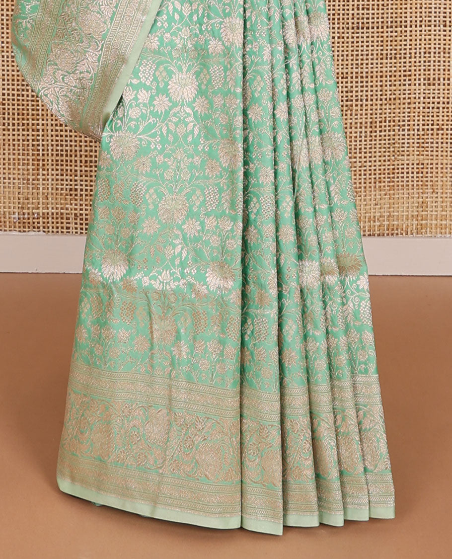 Green floral jacquard banaras silk saree with self border of zari design & floral design pallu