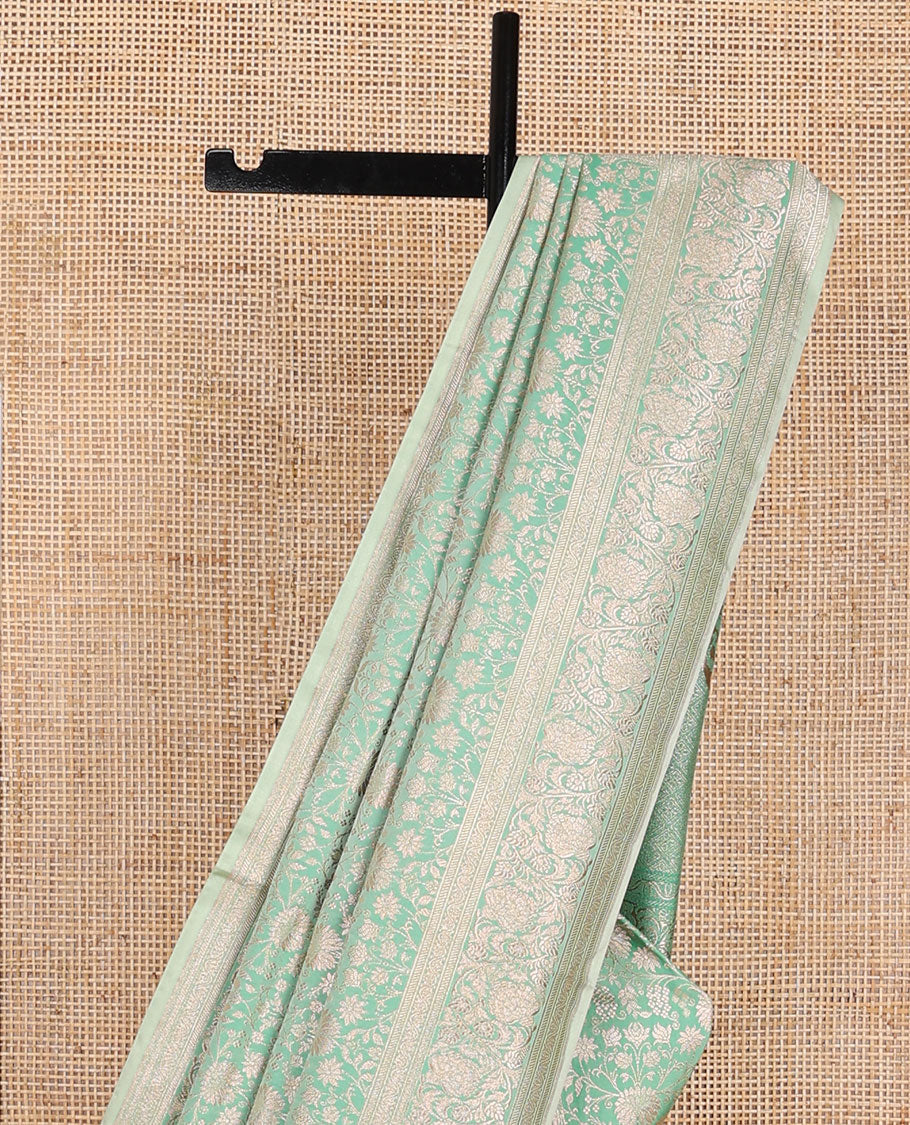 Green floral jacquard banaras silk saree with self border of zari design & floral design pallu