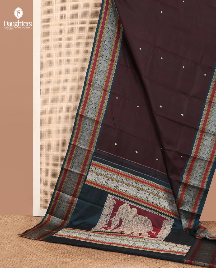 Brown mayil chakram thread buttas Kanchipuram silk saree, contrast border of thilakam mokku, mayil, yaali, and rudraksham, and pallu of big Nava Nari Kunjara motif