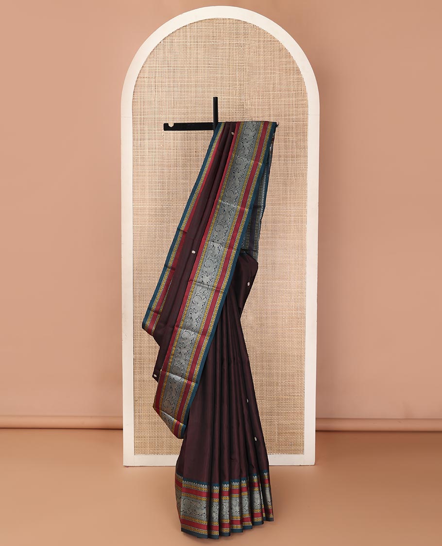 Brown mayil chakram thread buttas Kanchipuram silk saree, contrast border of thilakam mokku, mayil, yaali, and rudraksham, and pallu of big Nava Nari Kunjara motif