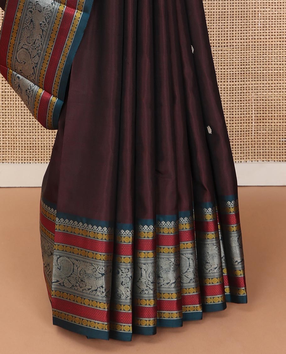 Brown mayil chakram thread buttas Kanchipuram silk saree, contrast border of thilakam mokku, mayil, yaali, and rudraksham, and pallu of big Nava Nari Kunjara motif