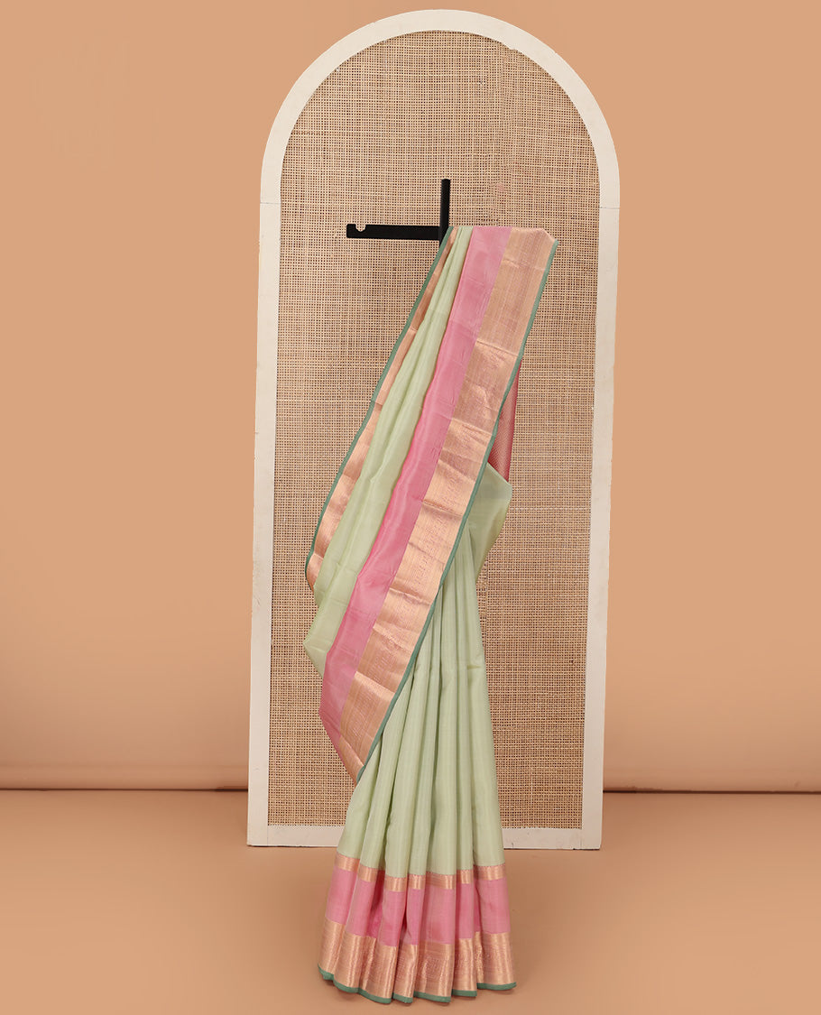 Tea green plain Kanchipuram silk saree, contrast rettai pettu border of muthu, kathir, kuyil kann,rudraksham, mayil, and kuthirai designs, and mayil kann pallu