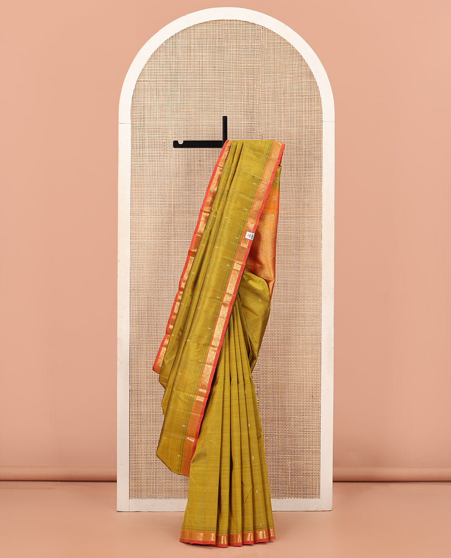 Green Kanchipuram Silk Saree Subtly Sparkled with Zari Buttas, Complemented by a Contrast Border of Jada Nagam Designs, Richly Zari Detailed Pallu, and Paired with a Contrast Blouse
