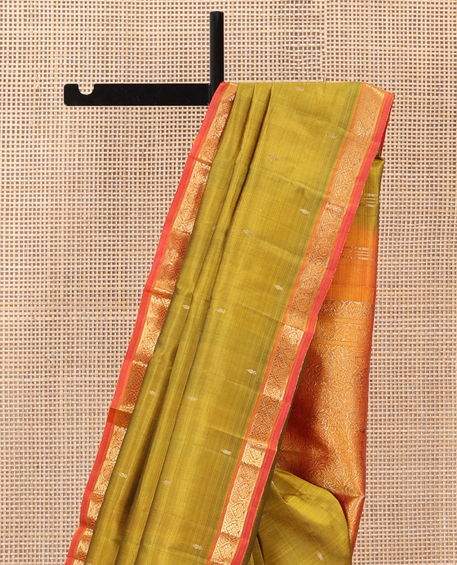 Green Kanchipuram Silk Saree Subtly Sparkled with Zari Buttas, Complemented by a Contrast Border of Jada Nagam Designs, Richly Zari Detailed Pallu, and Paired with a Contrast Blouse