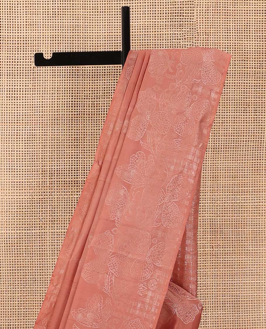 Peach three-leaf zari buttas soft silk saree, floral vine zari woven border, and zari-rich checked pallu