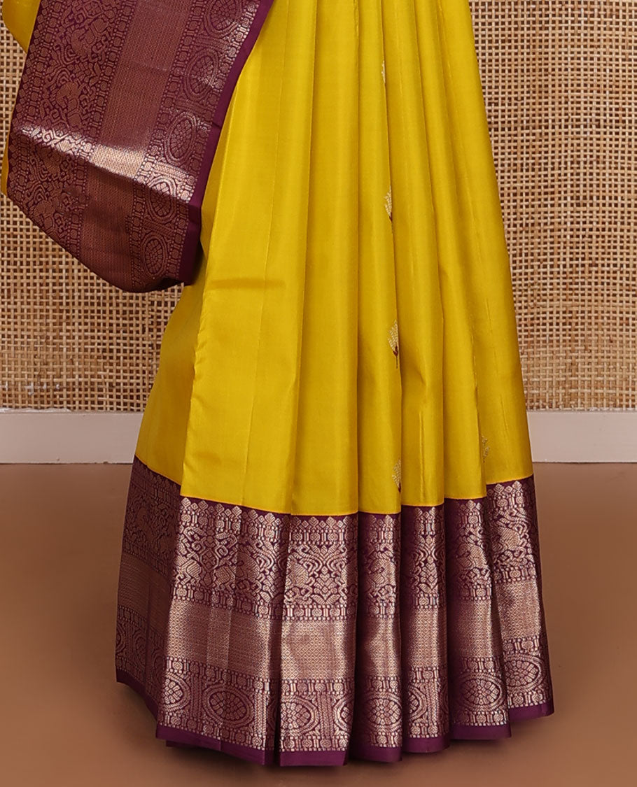 Yellow meena buttas silk saree, contrast border of thilakam,muthu,kuthirai, chakram & mayil kann & pallu of leaf designs
