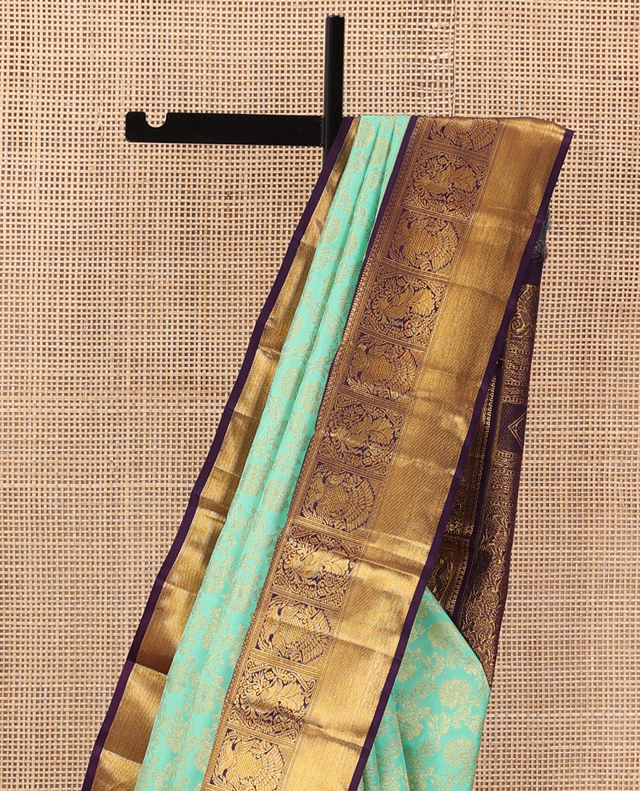 Turquoise jacquard wedding silk saree, contrast border of mayil, and iruthalai pakshi design, and floral design pallu