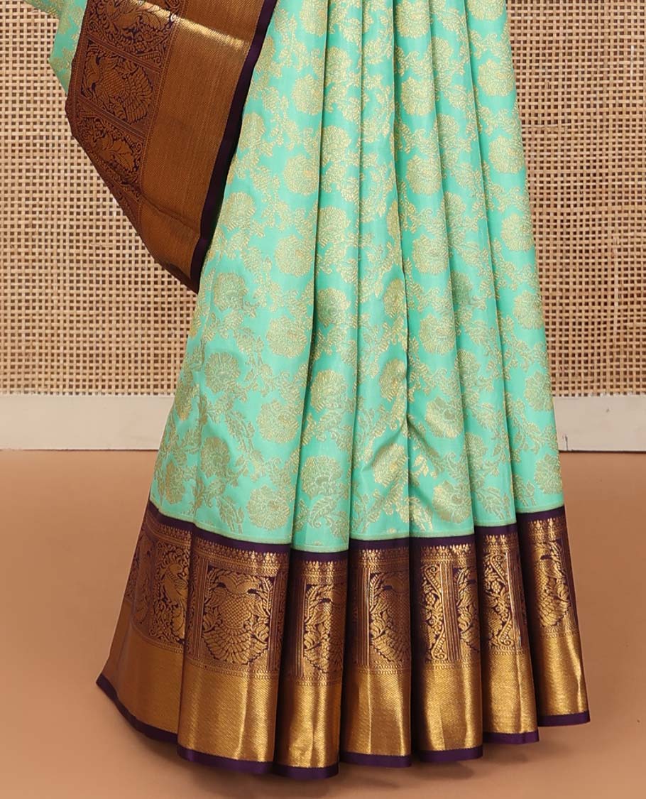 Turquoise jacquard wedding silk saree, contrast border of mayil, and iruthalai pakshi design, and floral design pallu