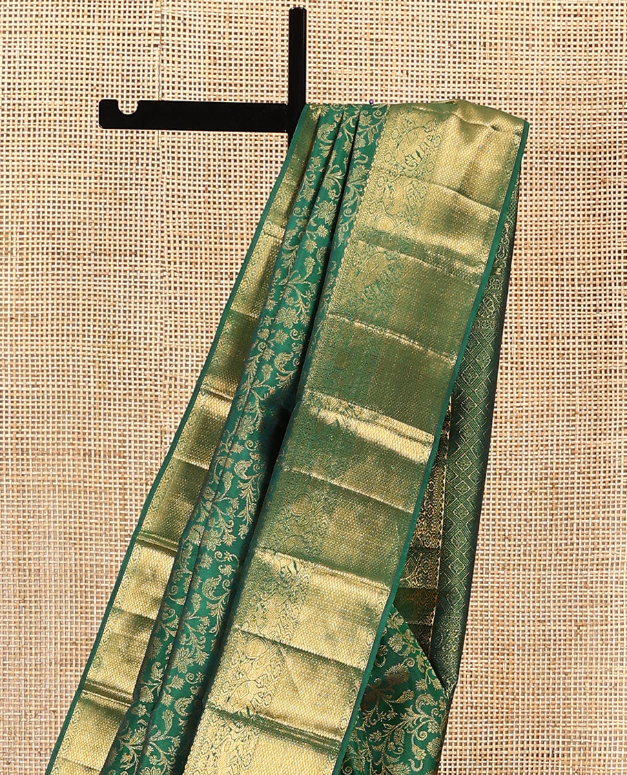 Green zari buttas woven kanchipuram silk saree, zari border of salngai, kamalam, yaali, yaanai, and mayil kann designs, and jaal pallu