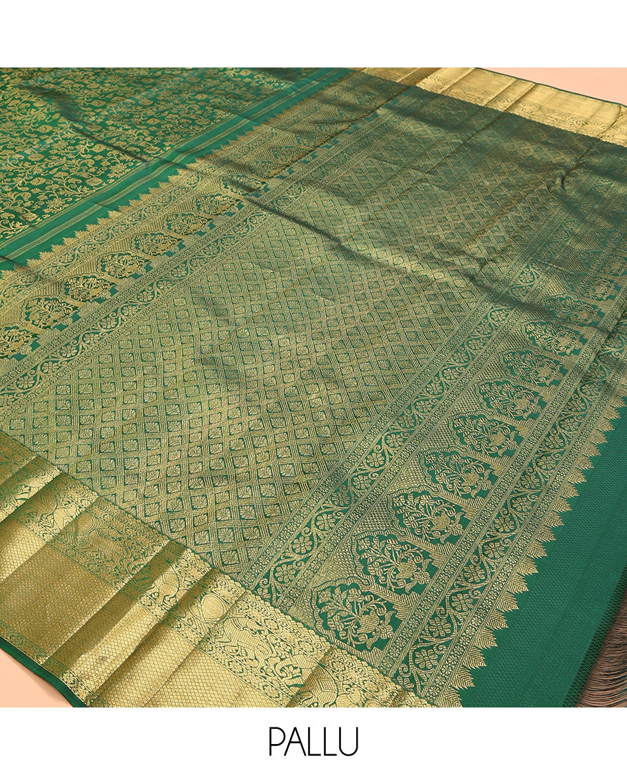 Green zari buttas woven kanchipuram silk saree, zari border of salngai, kamalam, yaali, yaanai, and mayil kann designs, and jaal pallu