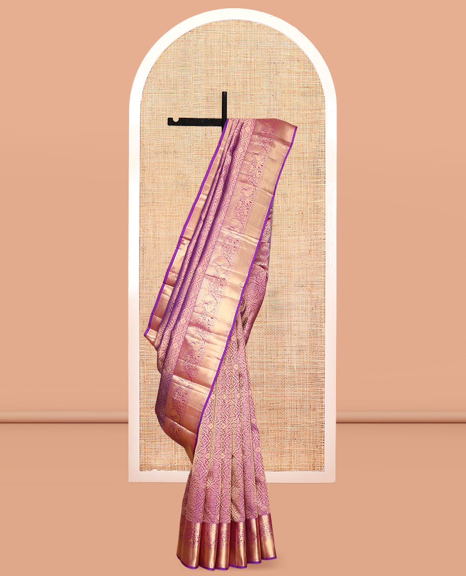 Pink Kanchipuram Wedding Silk Saree, Graced with Jacquard Design, a Zari Border of Thilakam Mokku, Muthu, Rudraksham, Yaanai and Mayil, Grand Pallu, and a Matching Blouse